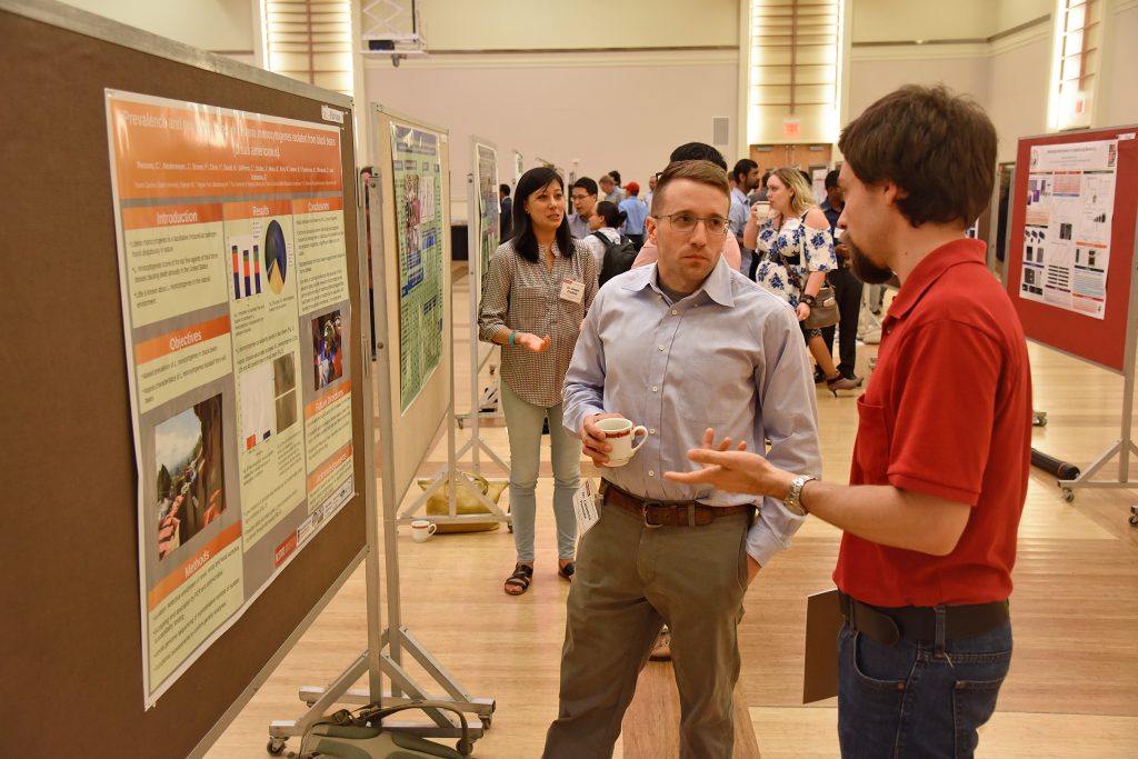 Graduate student presenting his research at Talley Student Union